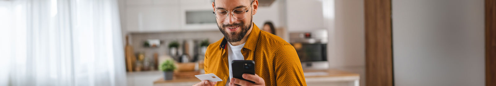 Man paying with credit card from home